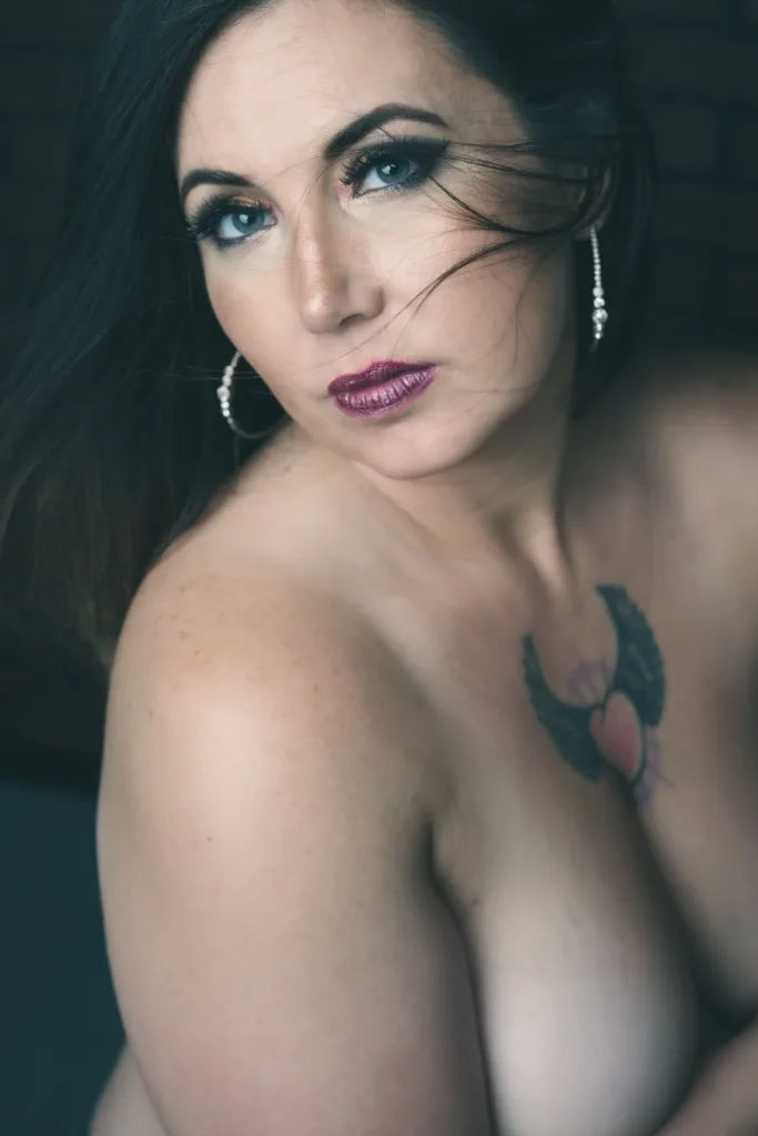woman with glamorous makeup, implied nude